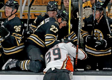 Bruins blow late two-goal lead, suffer first loss of season in overtime